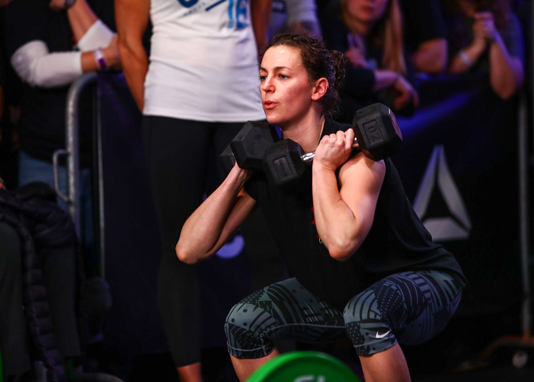 Lauren from CrossFit R.A.W. performing a dumbbell squat