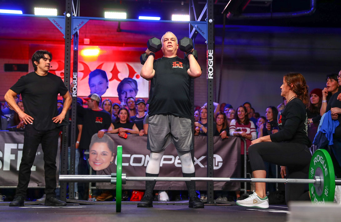 Bob from CrossFit R.A.W. performing dumbbell squat during 18.2