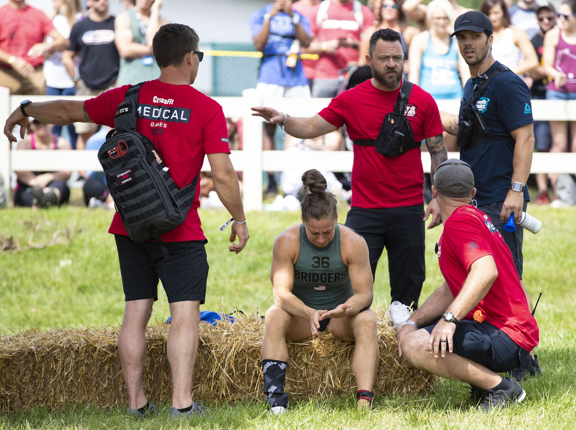 Emily Bridgers receives Medical attention after suffering an injury in The Battlegrounds at the 2018 Reebok CrossFit Games 