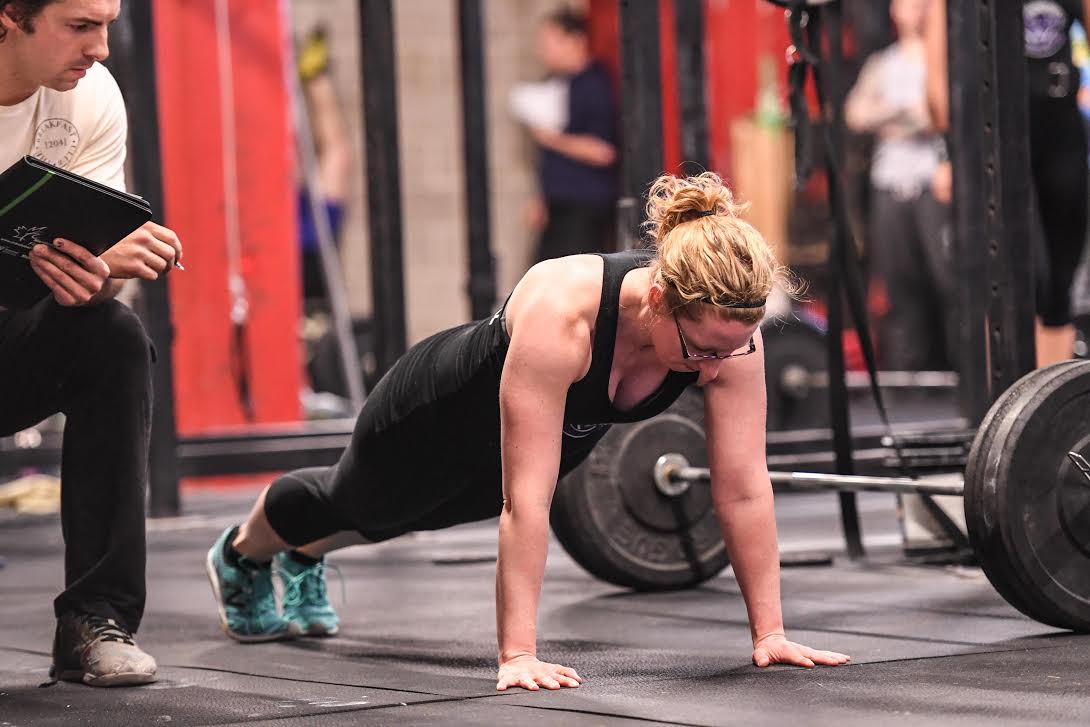 Athlete demonstrates good push-up form during (scaled) 18.4