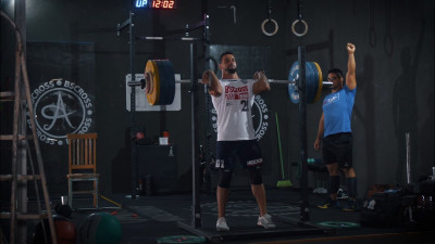 Athlete front squatting