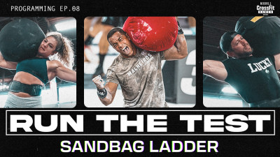 Athletes lift sandbags