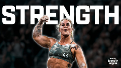 Dani Speegle flexes bicep.