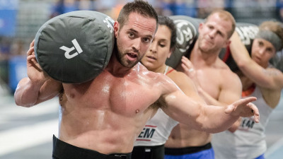 Froning and Team Mayhem with the Worm shouldered